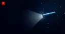 A space telescope shining a beam of light on a small asteroid against a starfield