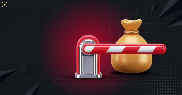 Lowered red and white boom barrier blocking a gold money bag on a dark ground