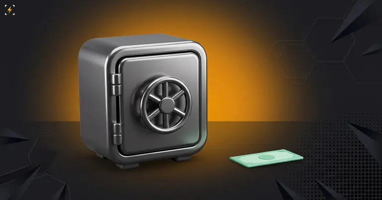 Closed steel safe beside a single banknote lying on the ground