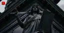 Statue of justice with a sword and law tablet