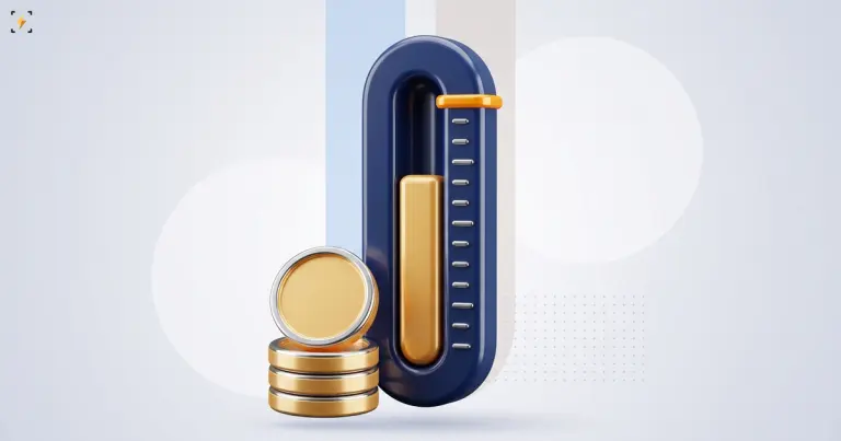 Gold fill in a navy gauge stopping short of the amber target marker beside a stack of coins