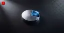 A metal disc with a breaking-away wedge symbolizes Luno cutting 20% of its staff