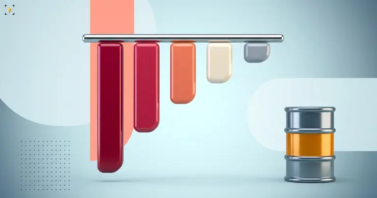 Five bars of very different lengths hanging from a rail beside an oil barrel standing still