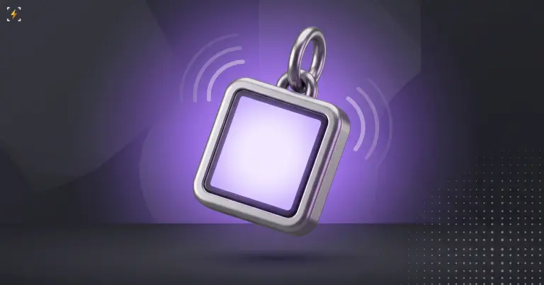 A small square silver gadget with a blank glowing violet screen hanging from a metal keyring, with sound-wave arcs beside it on a dark background