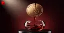 A cracked Bitcoin coin dripping molten gold symbolizes Strategy's real BTC sale to fund dividends
