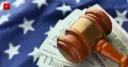 Judge gavel on dollars and the US flag