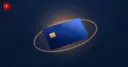 Payment card with an orbiting ring symbolizing stablecoin payouts through the Visa Direct network