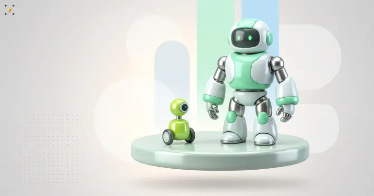Large friendly humanoid robot on a podium beside a tiny two-wheeled desktop robot