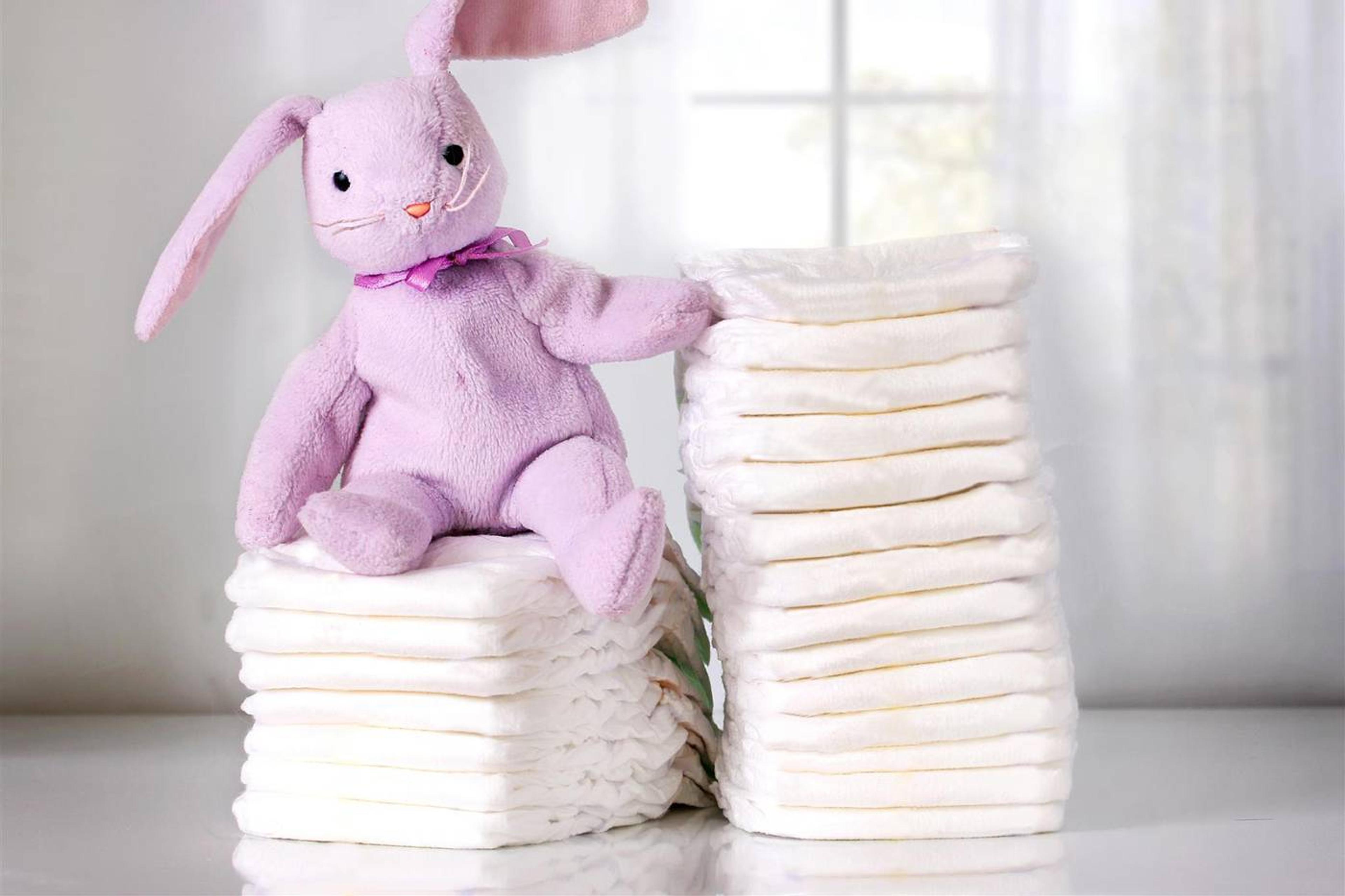 baby shower diaper raffle prizes: diapers with a stuffed bunny