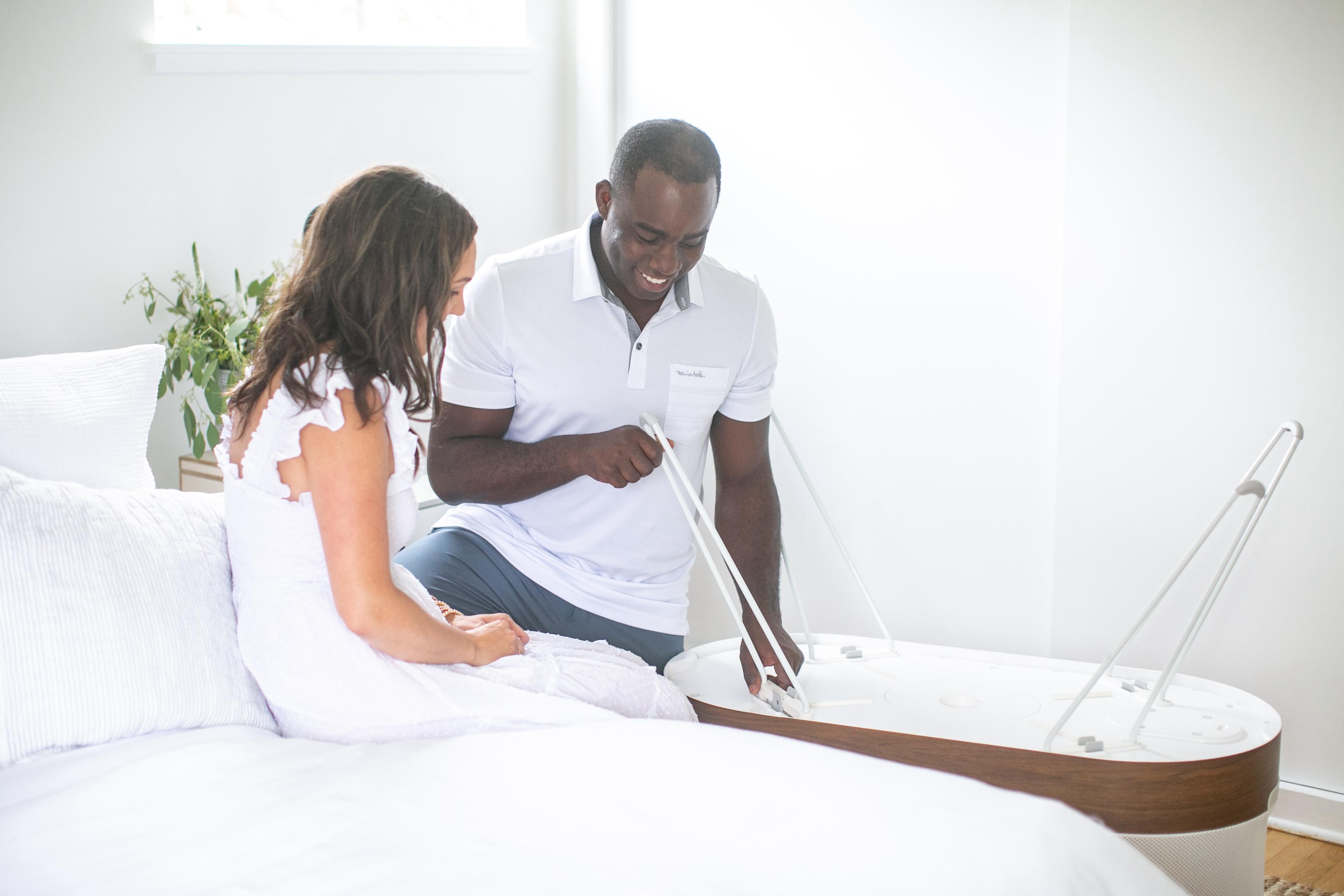 A mom sets up her SNOO Smart Sleeper