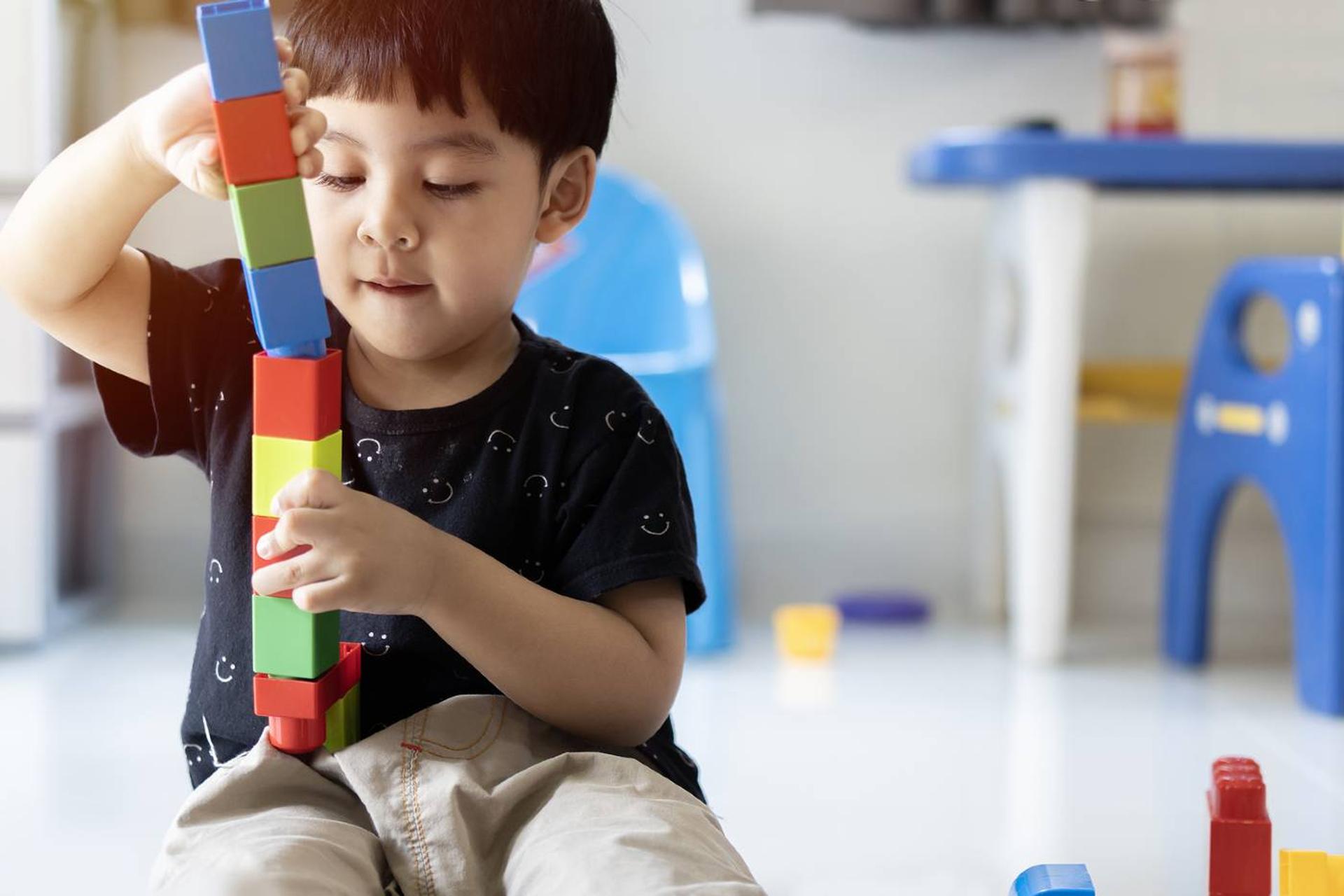 Toddler playing with blocks