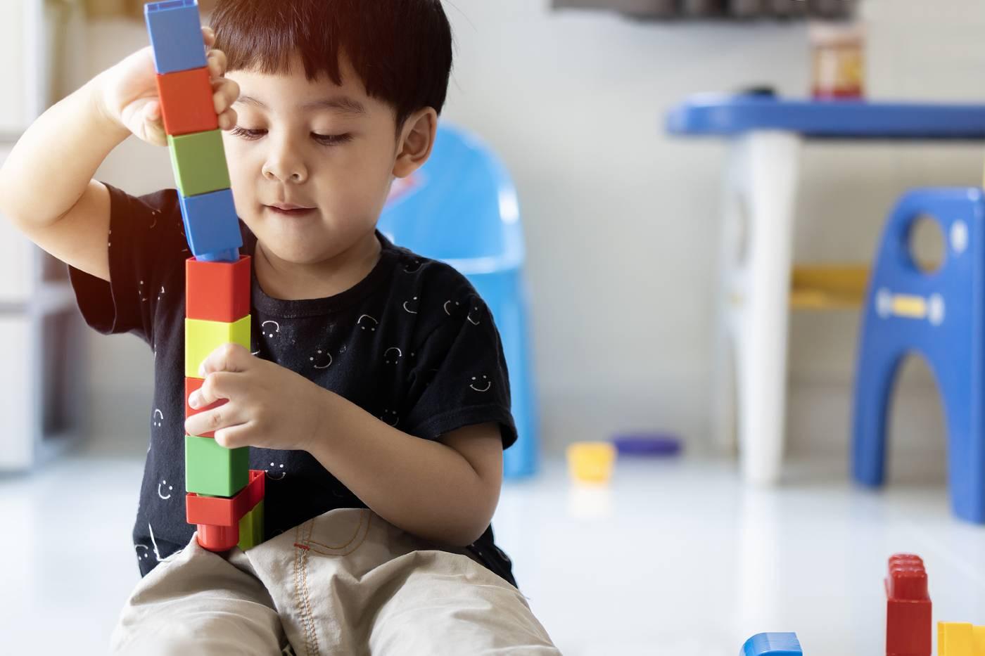 Toddler playing with blocks
