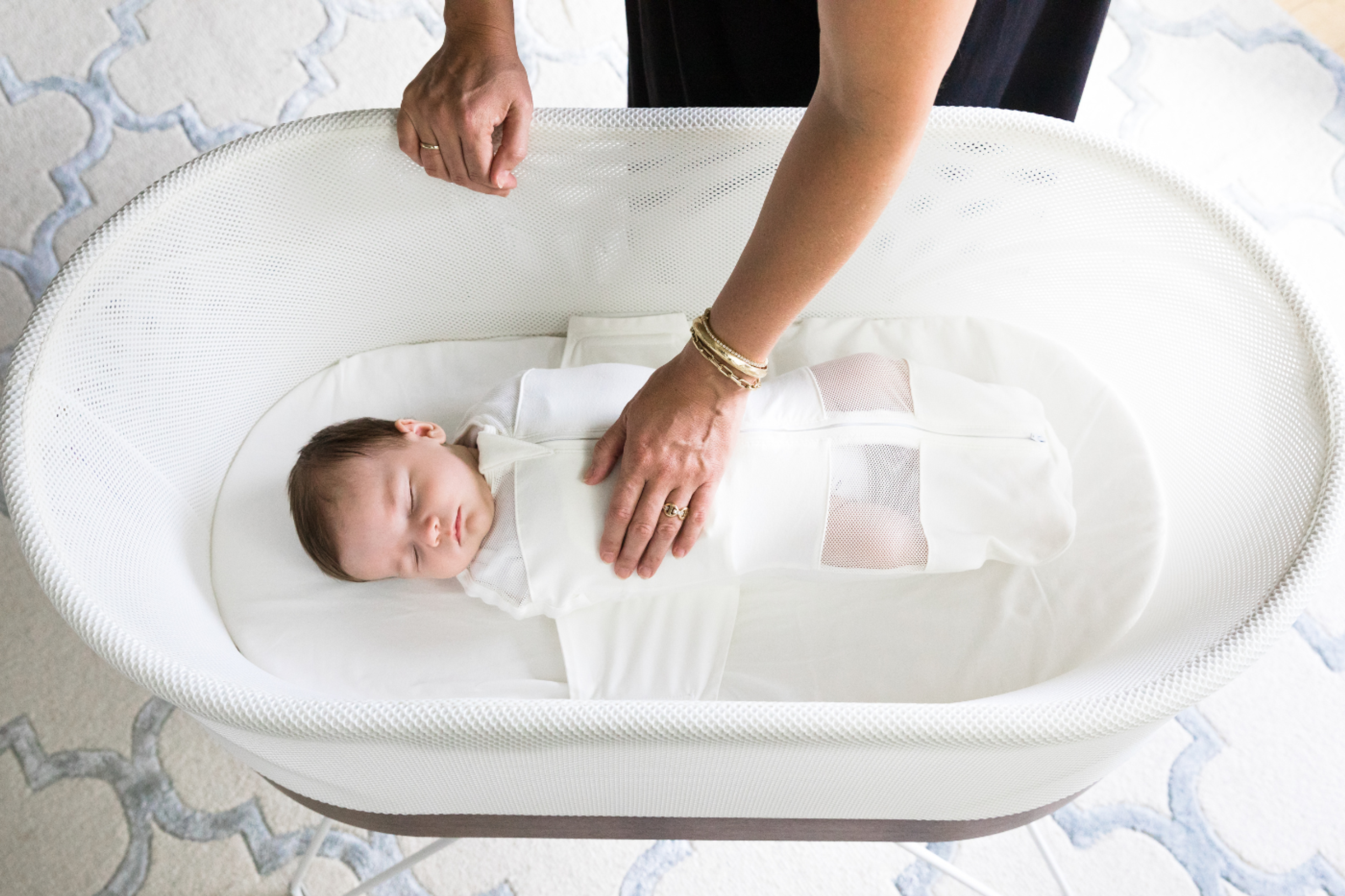 Baby safely sleeping in SNOO