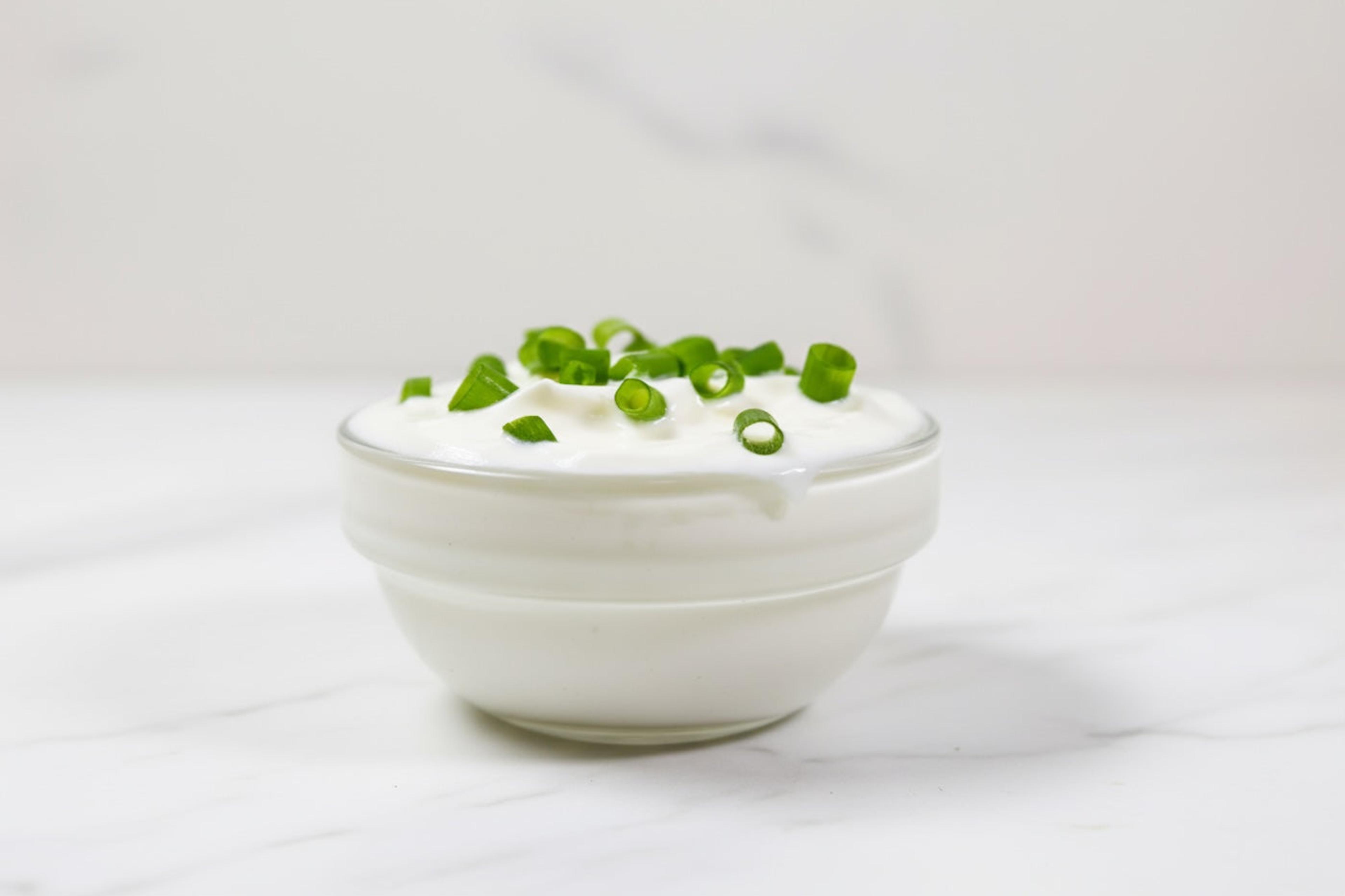 Bowl of sour cream topped with chives