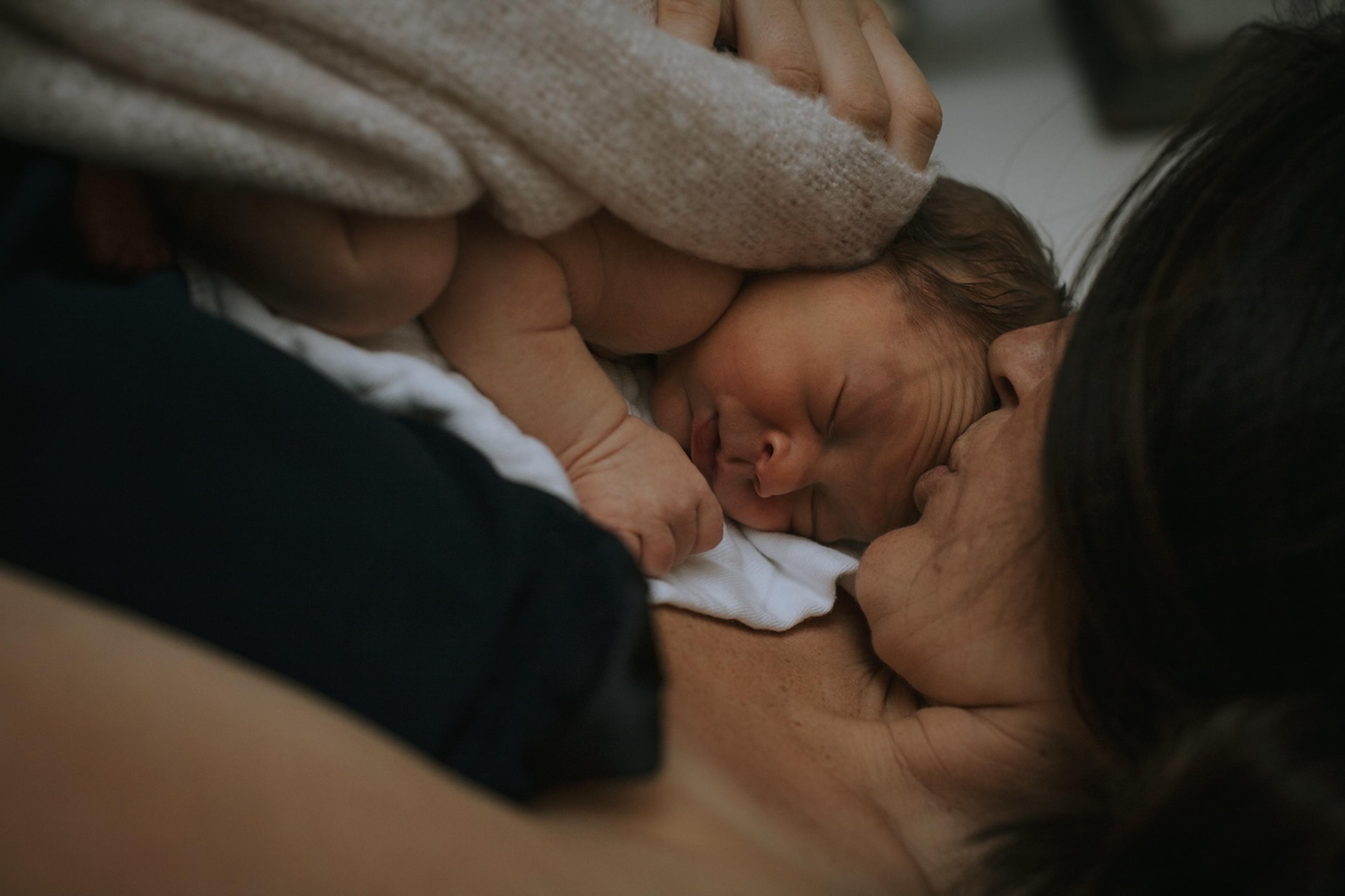 Mother consoles baby during night waking