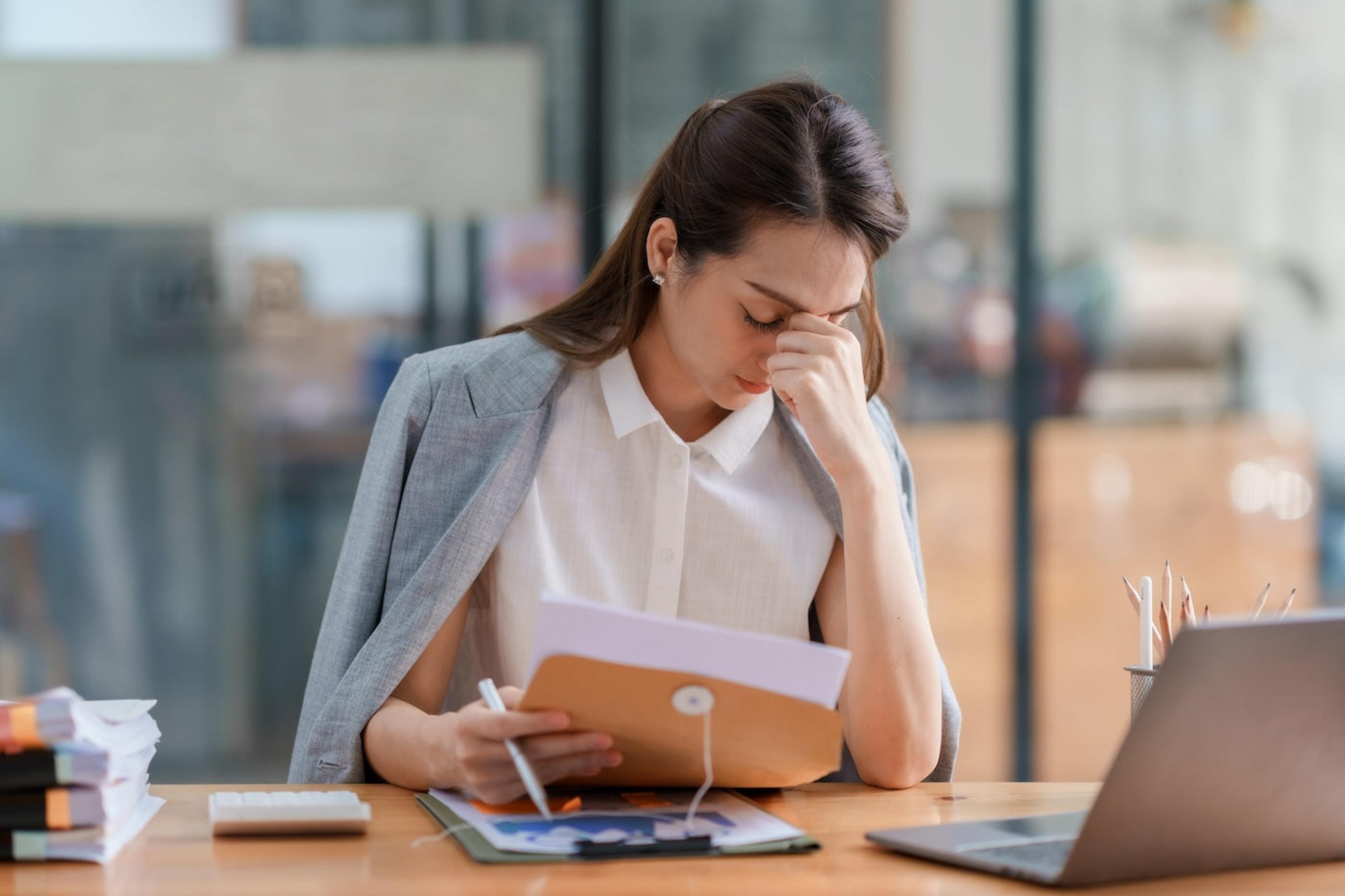 Woman suffering from burnout at work