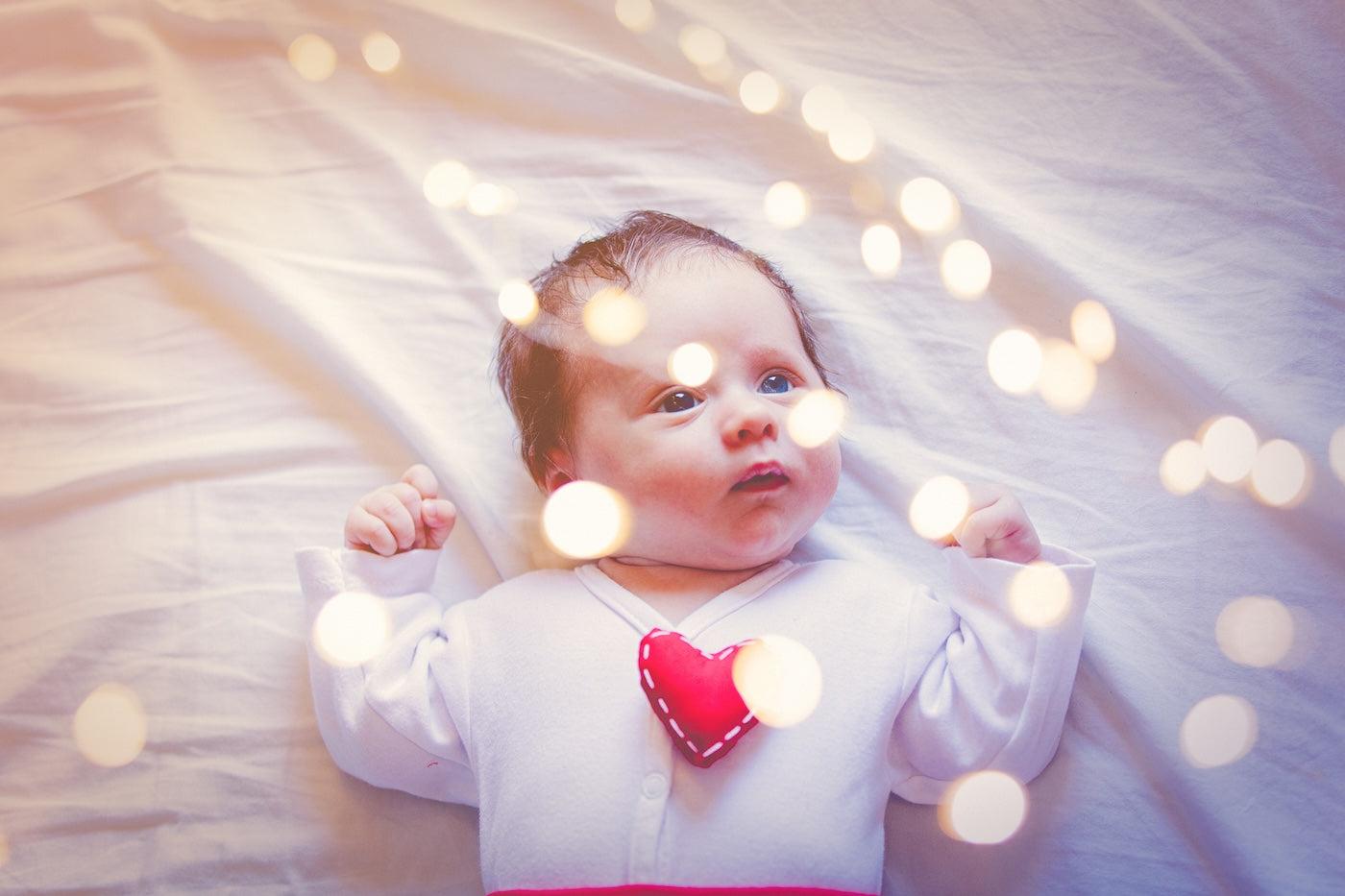 Baby looking at twinkle lights