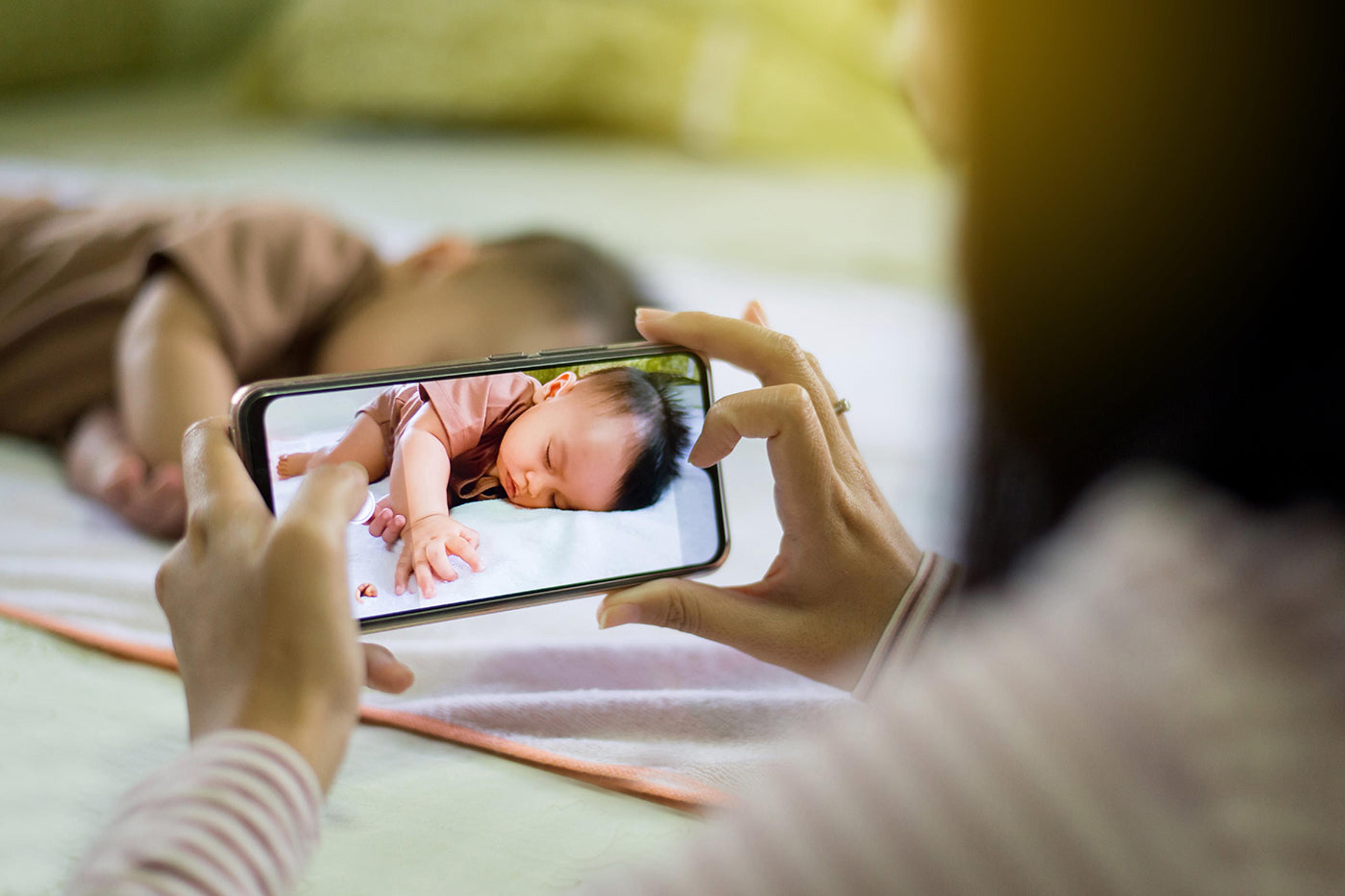 mom-taking-picture-of-baby