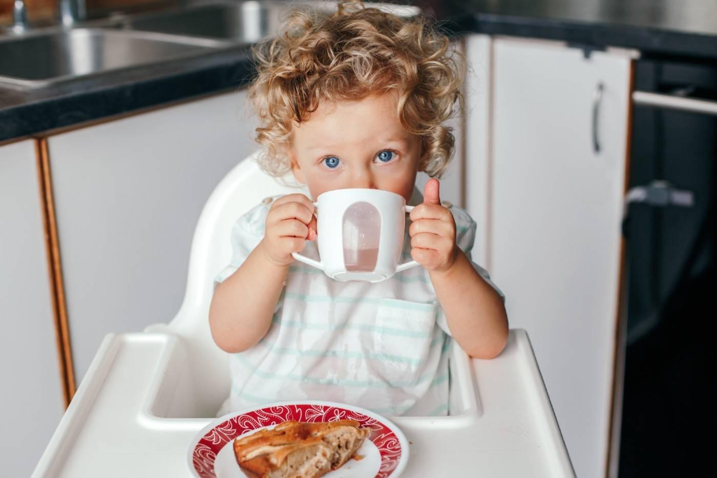 Baby learning to use a cup