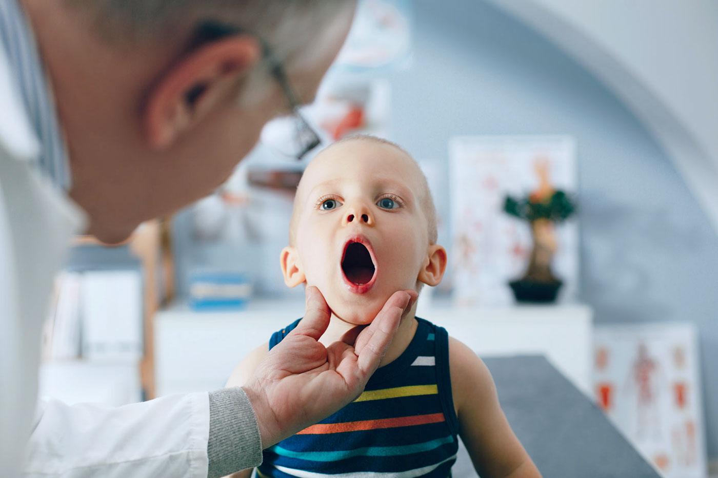 doctor looking at child who swallowed a foreign object