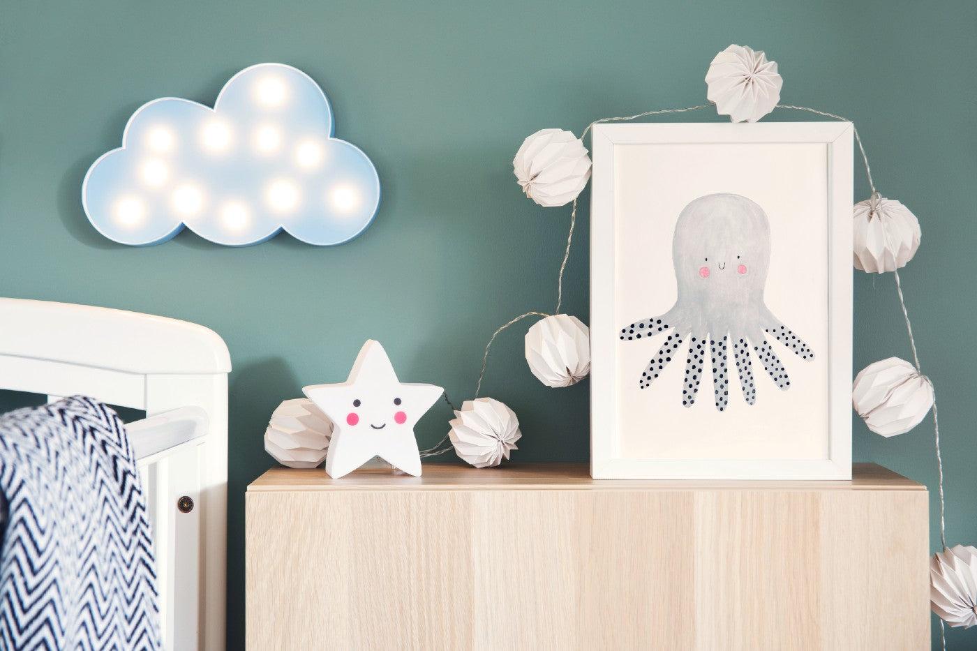 A cloud-shaped nursery lamp and string lights