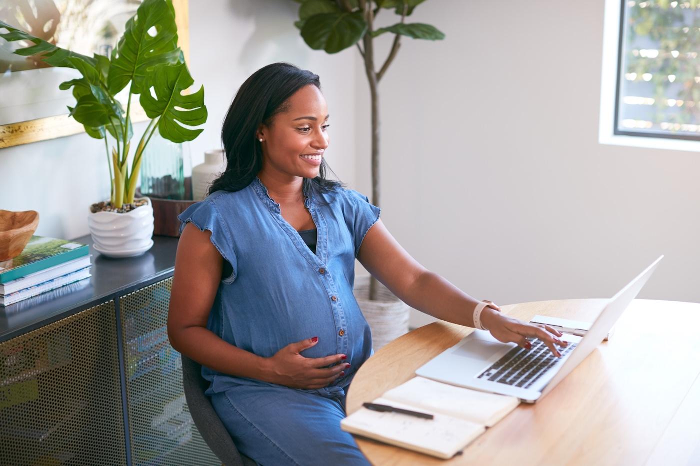 A pregnant woman interviews for a job over Zoom