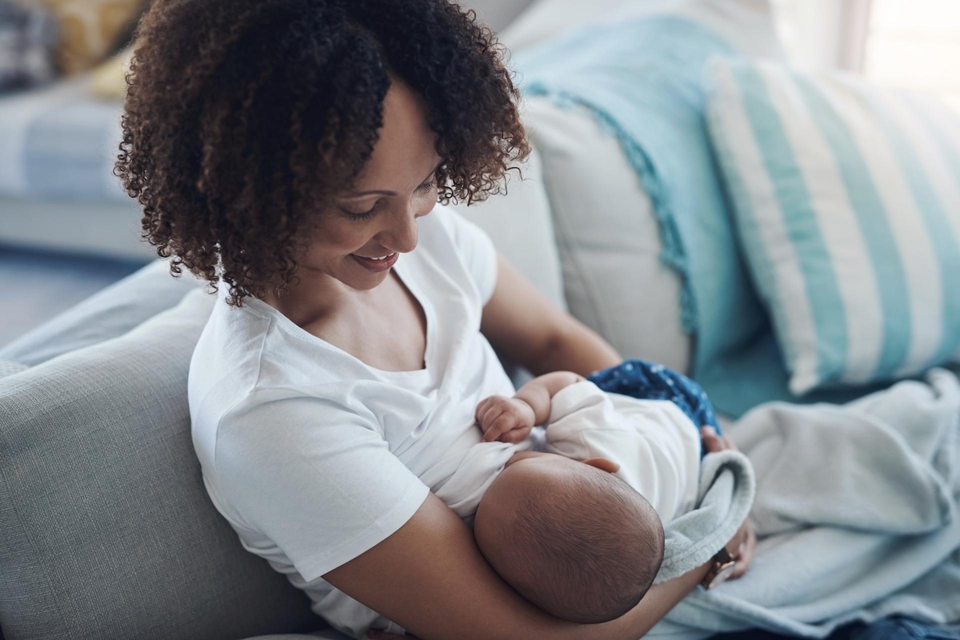 A mother breastfeeds her baby