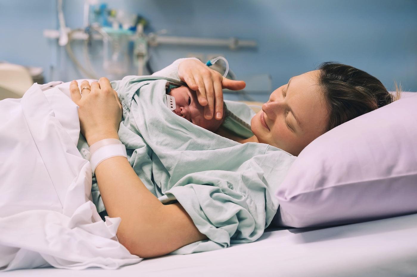 Mom doing skin-to-skin contact with her newborn in the hospital