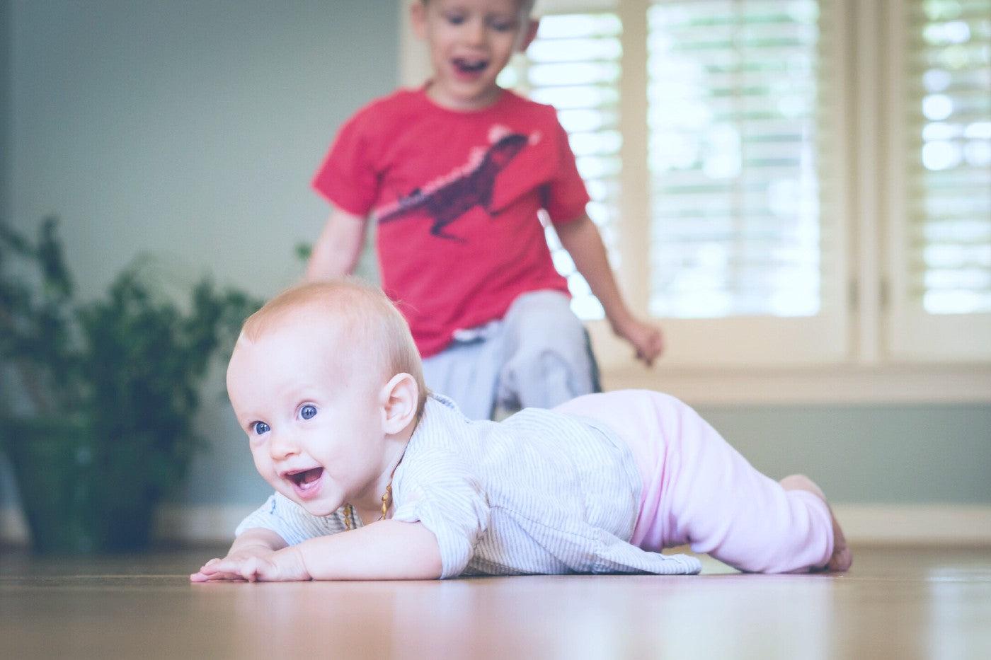 A baby learns to crawl for the first time