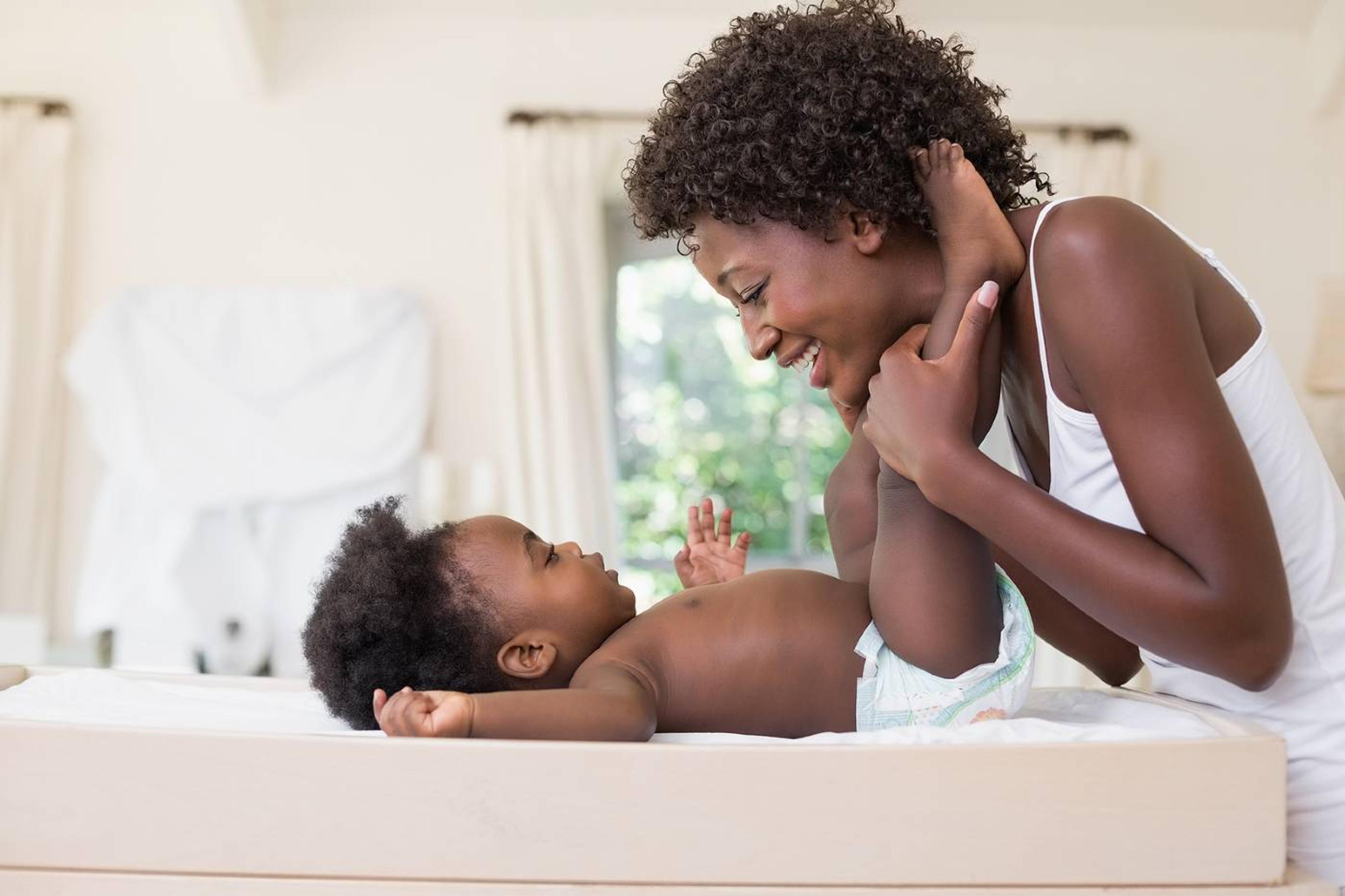 Mom with baby on diaper changing table