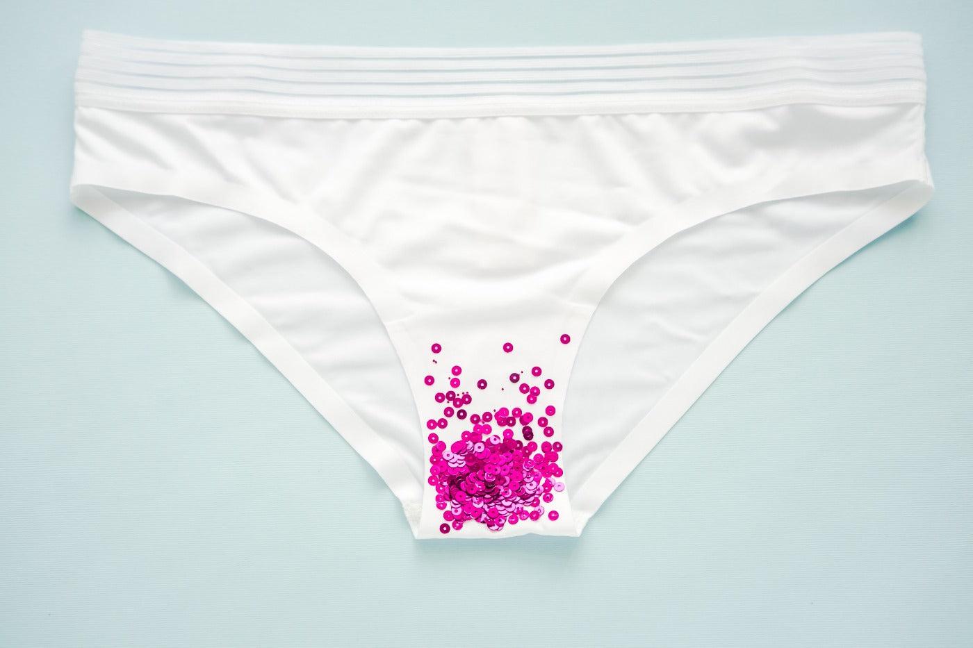 white underpants with sequin blood to show implantation bleeding