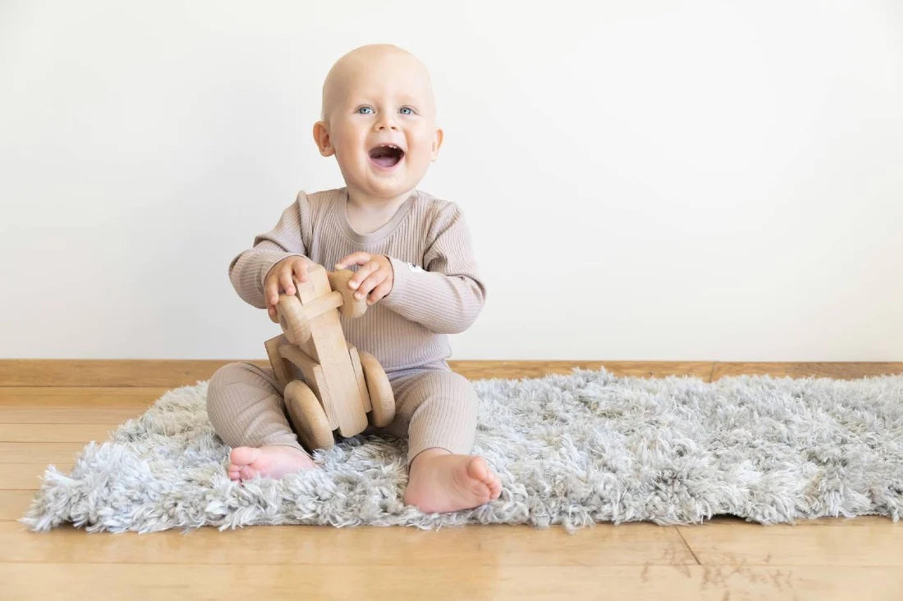 Baby playing with a safe toy