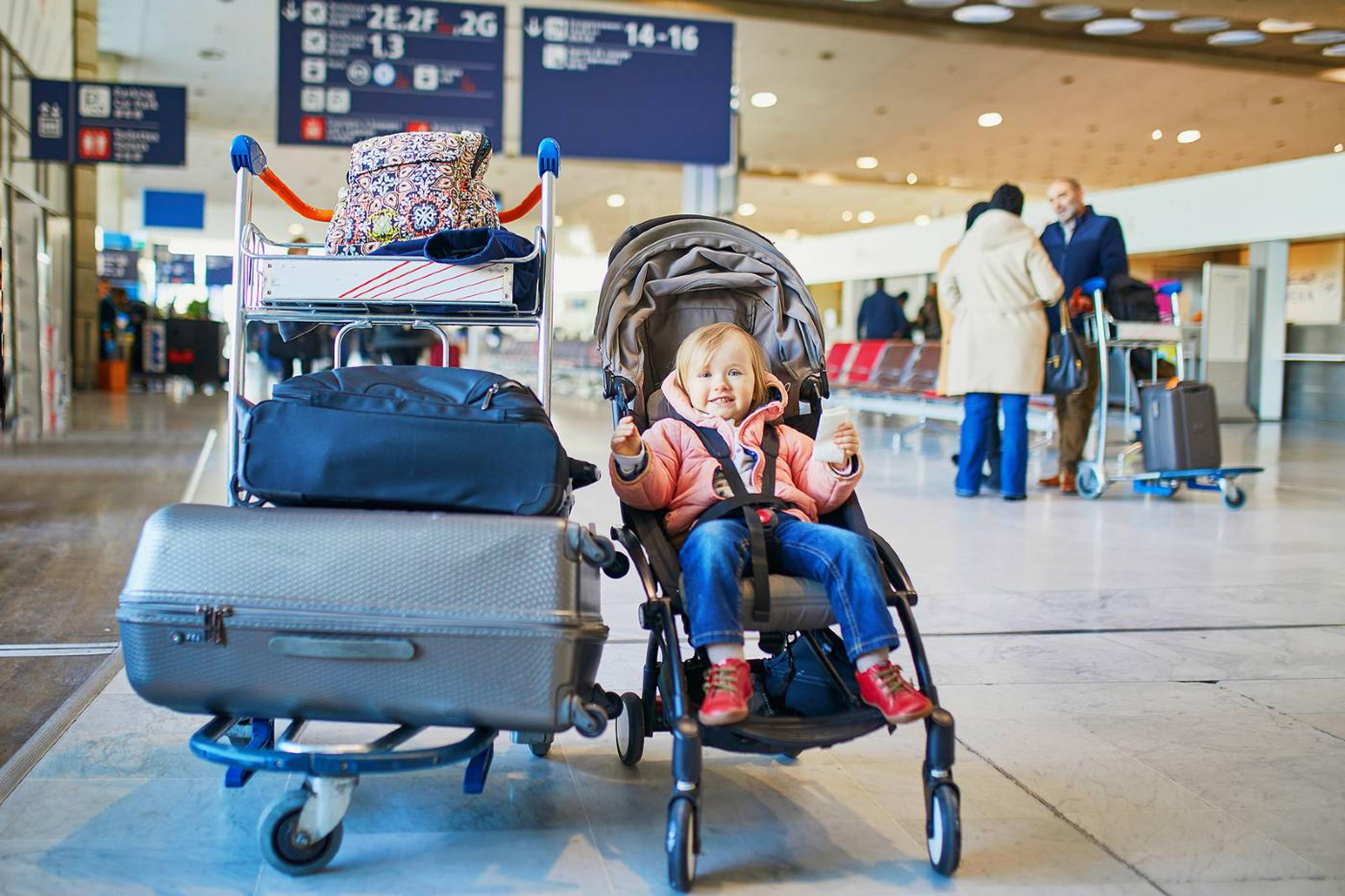 Toddler in stroller at the airport