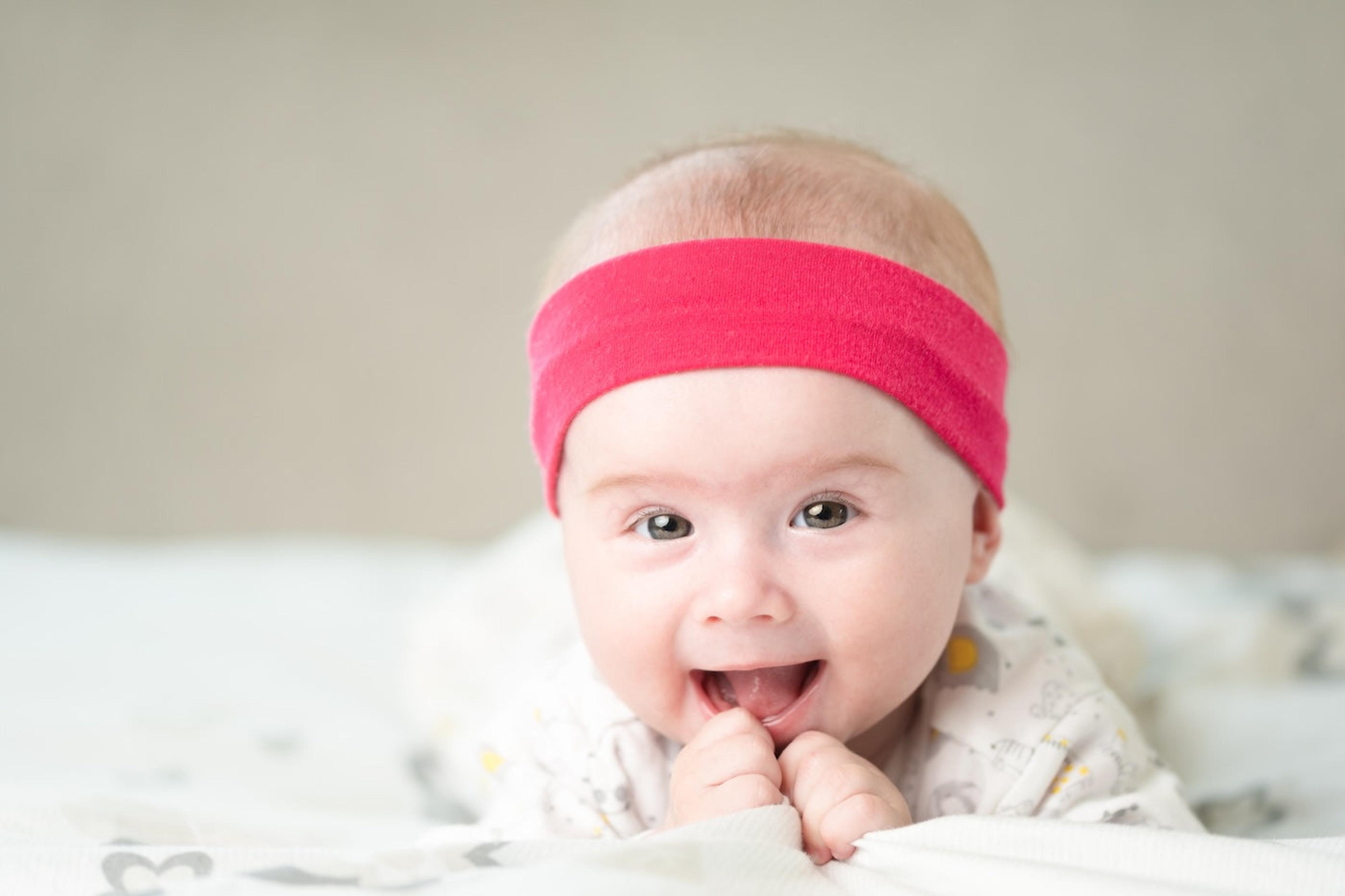 80s baby wearing pink sweatband 