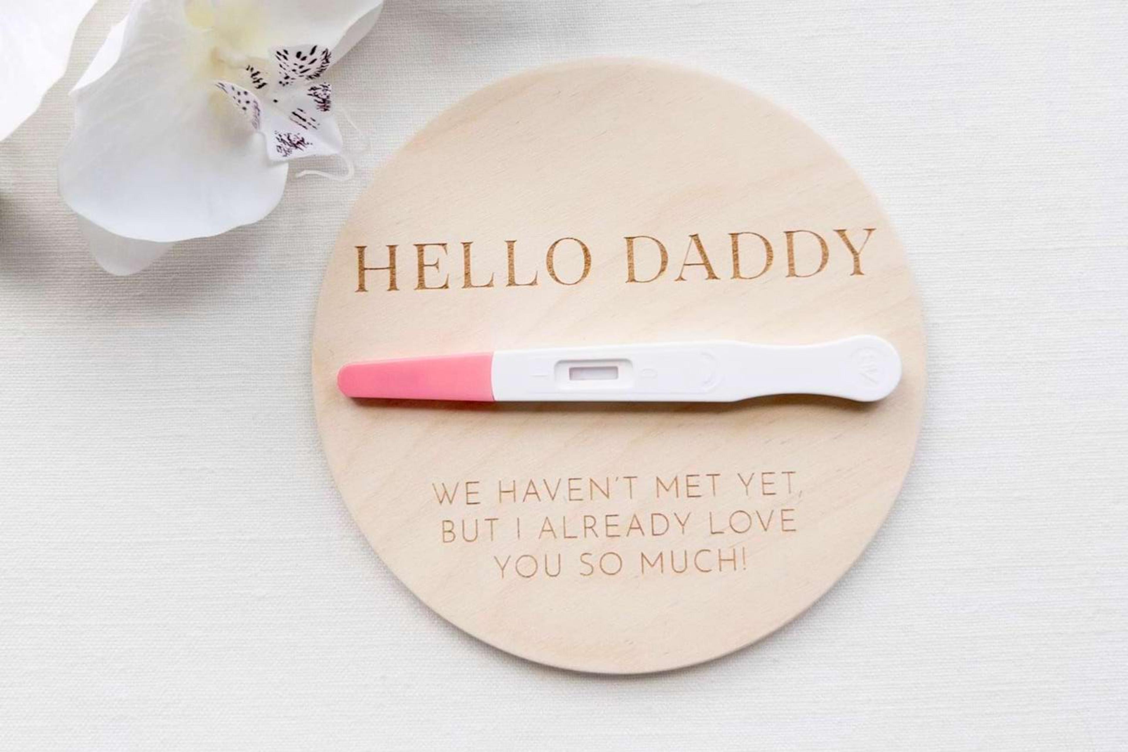 Father's Day pregnancy announcement with a positive pregnancy test