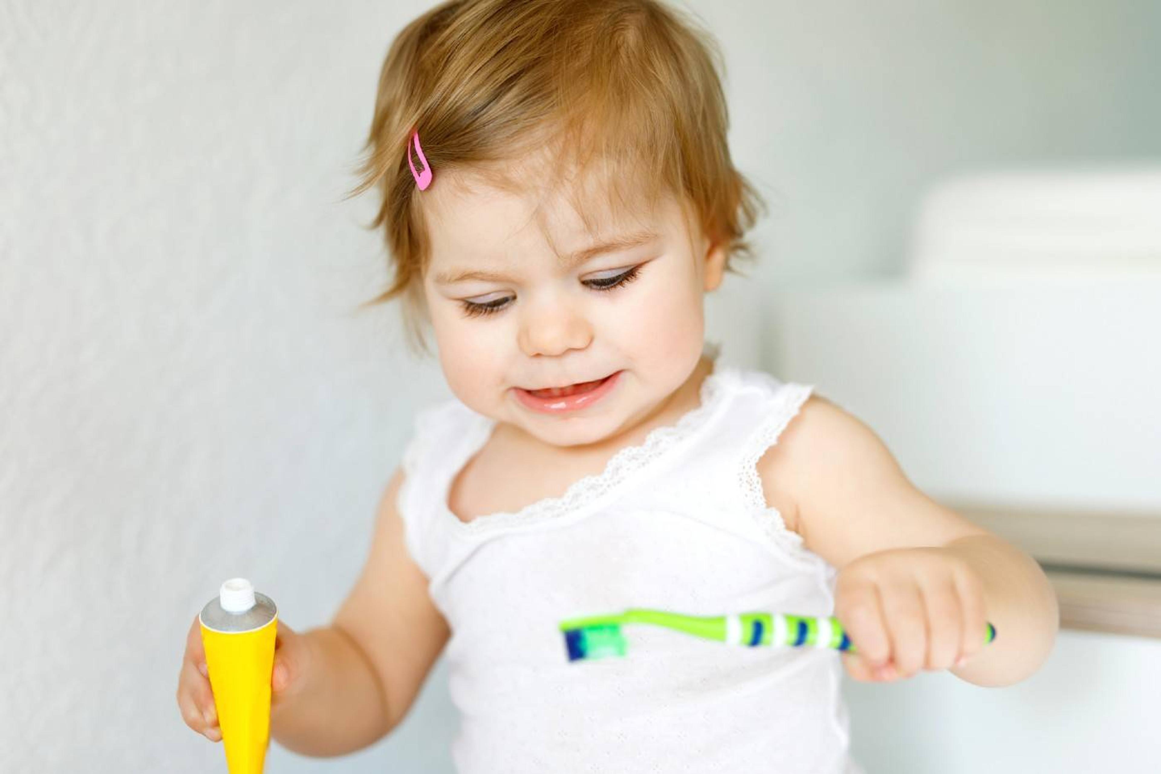 Baby learning to brush teeth