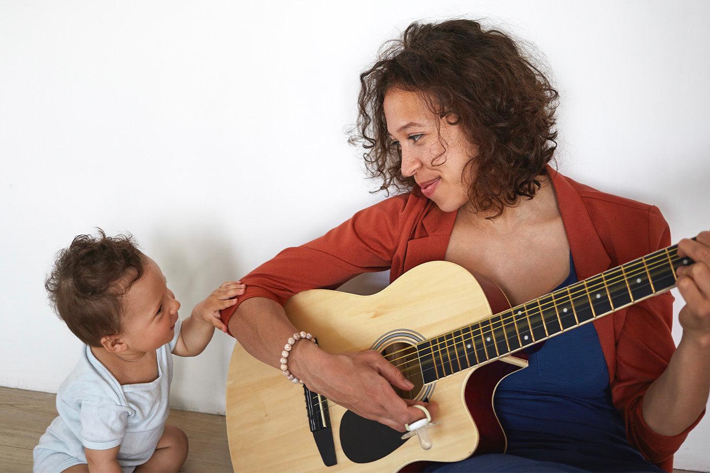 mom-singing-playing-guitar-with-child