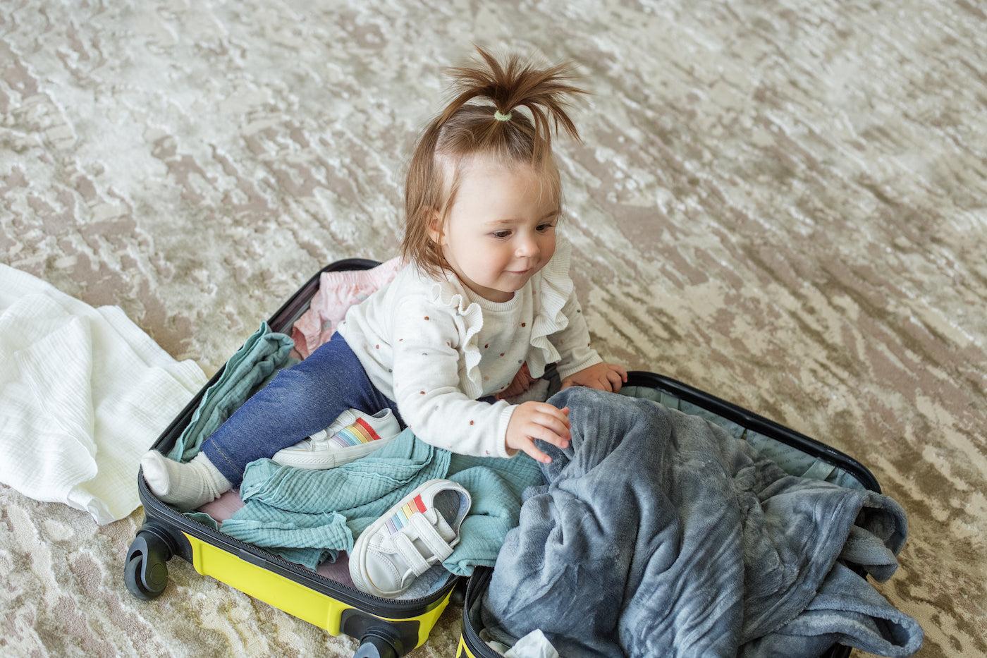 A toddler ready to travel