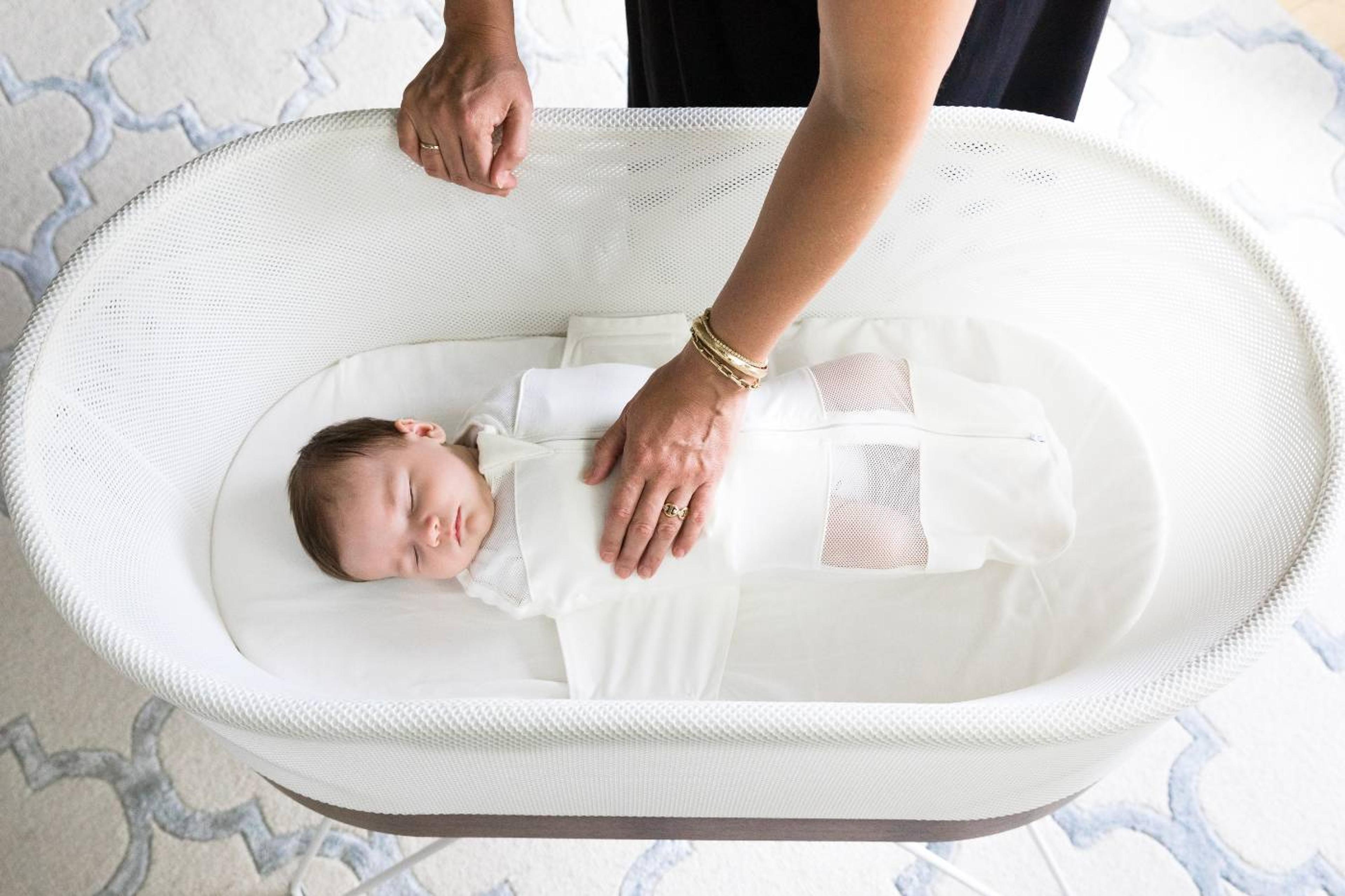 Baby safely sleeping in SNOO