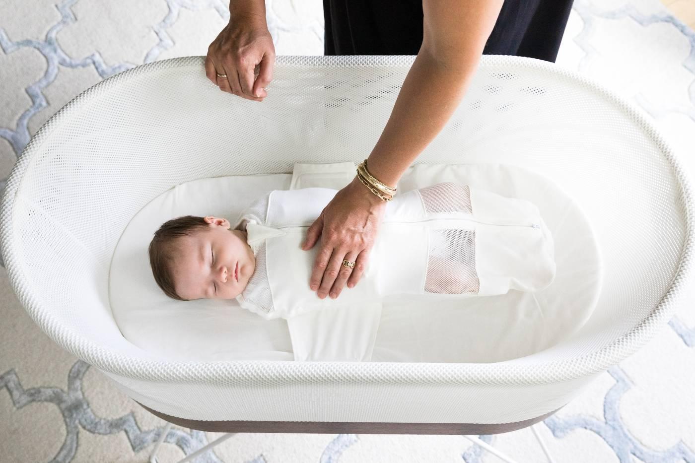 Baby safely sleeping in SNOO