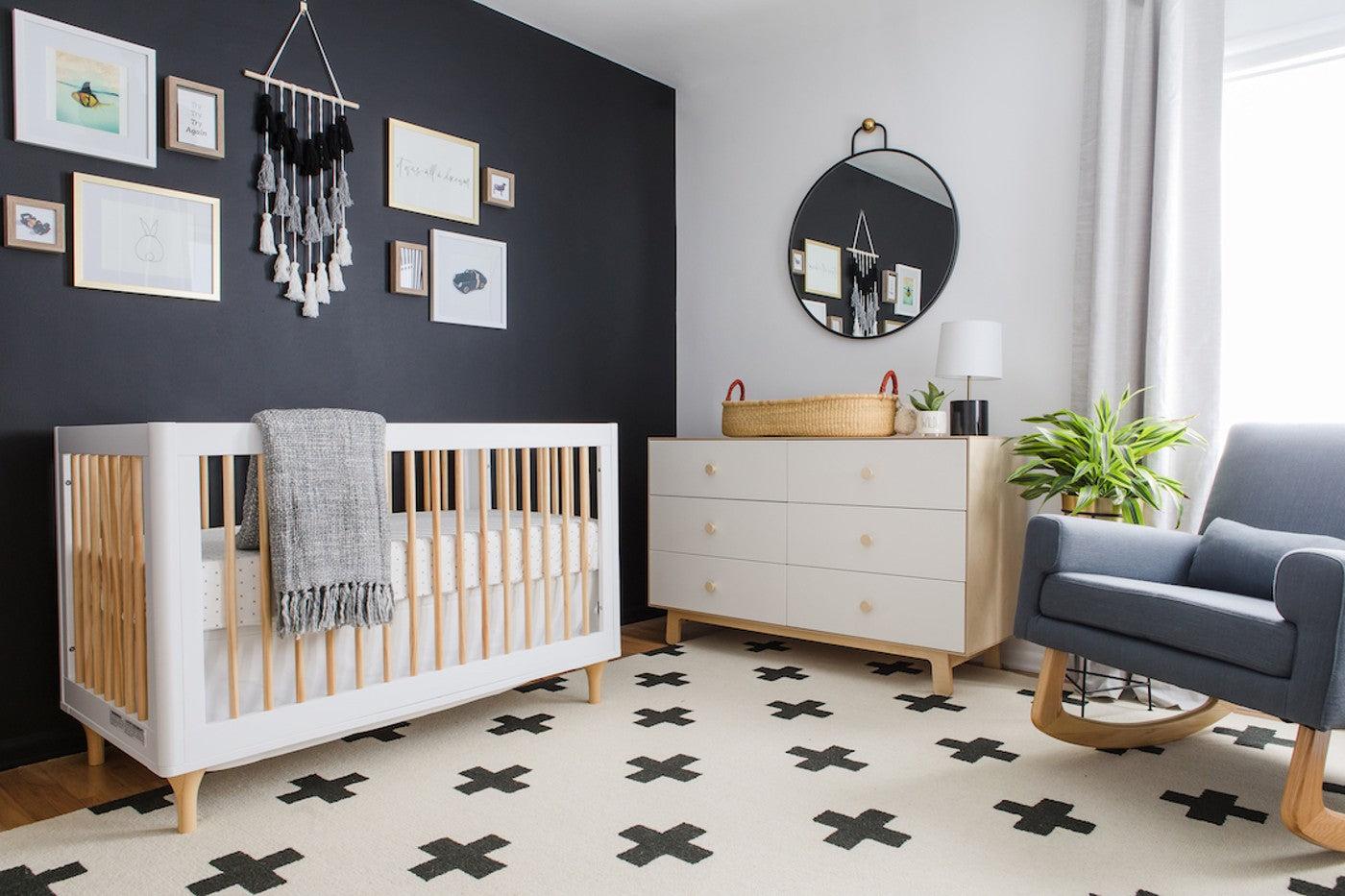 A nursery layout with the crib next to the changing table