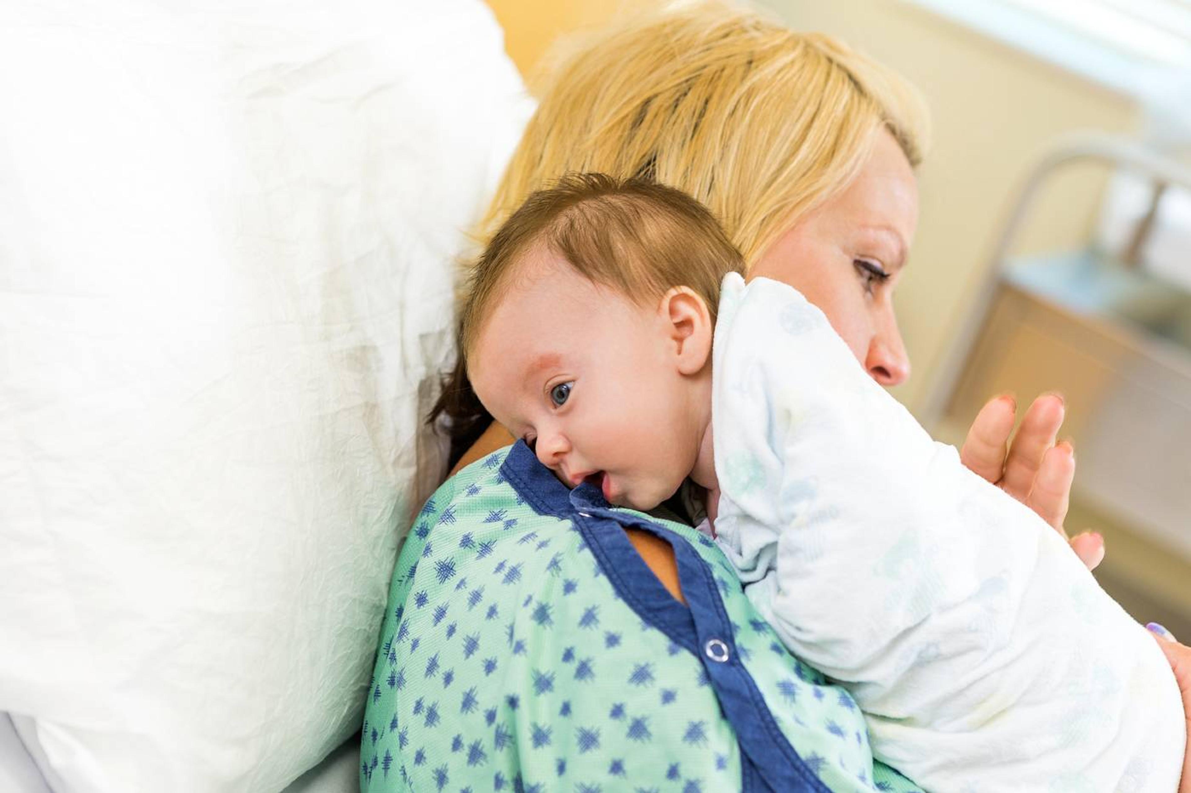 Parent burping newborn in hospital