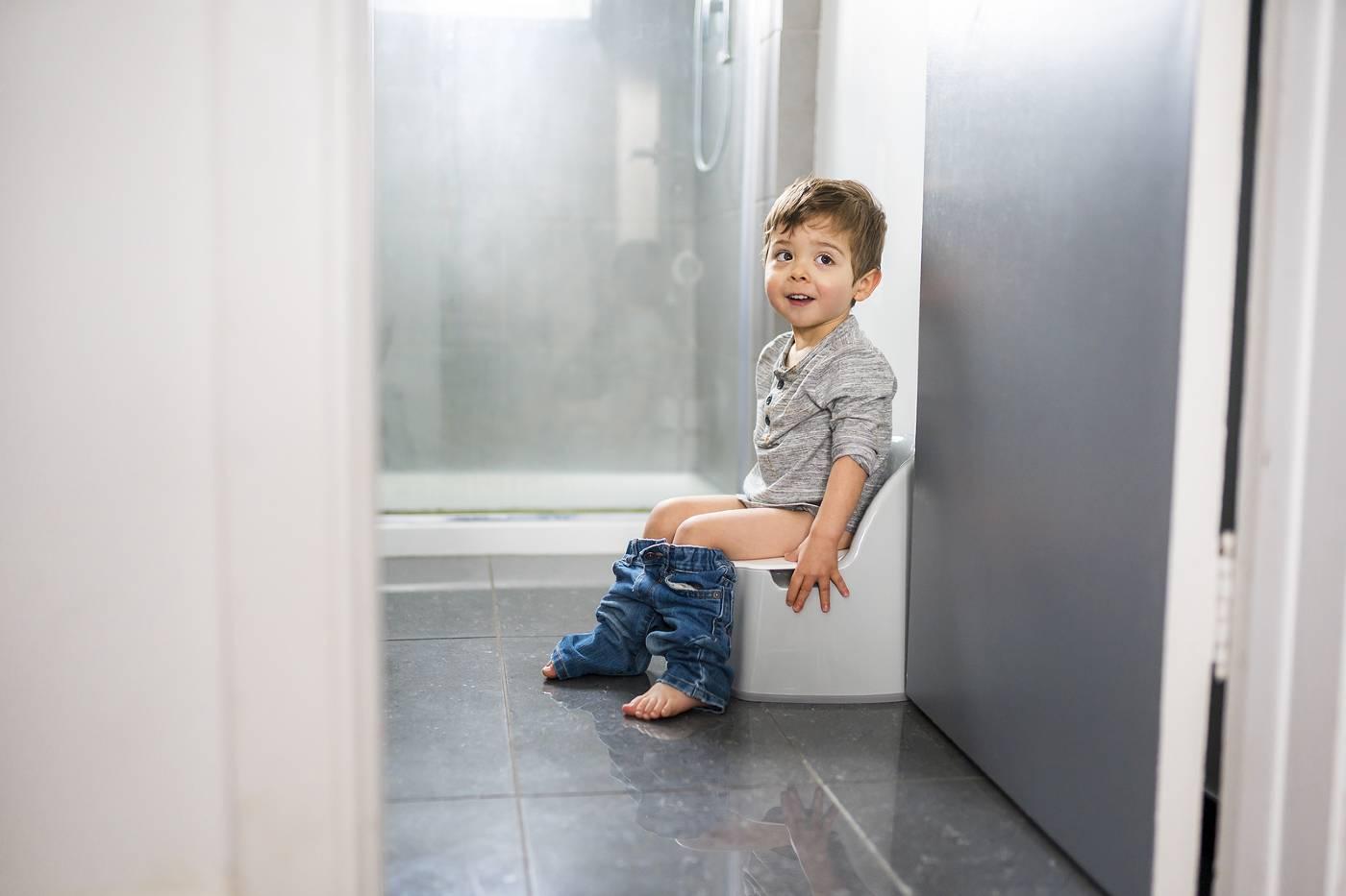 Toddler potty-training on toilet