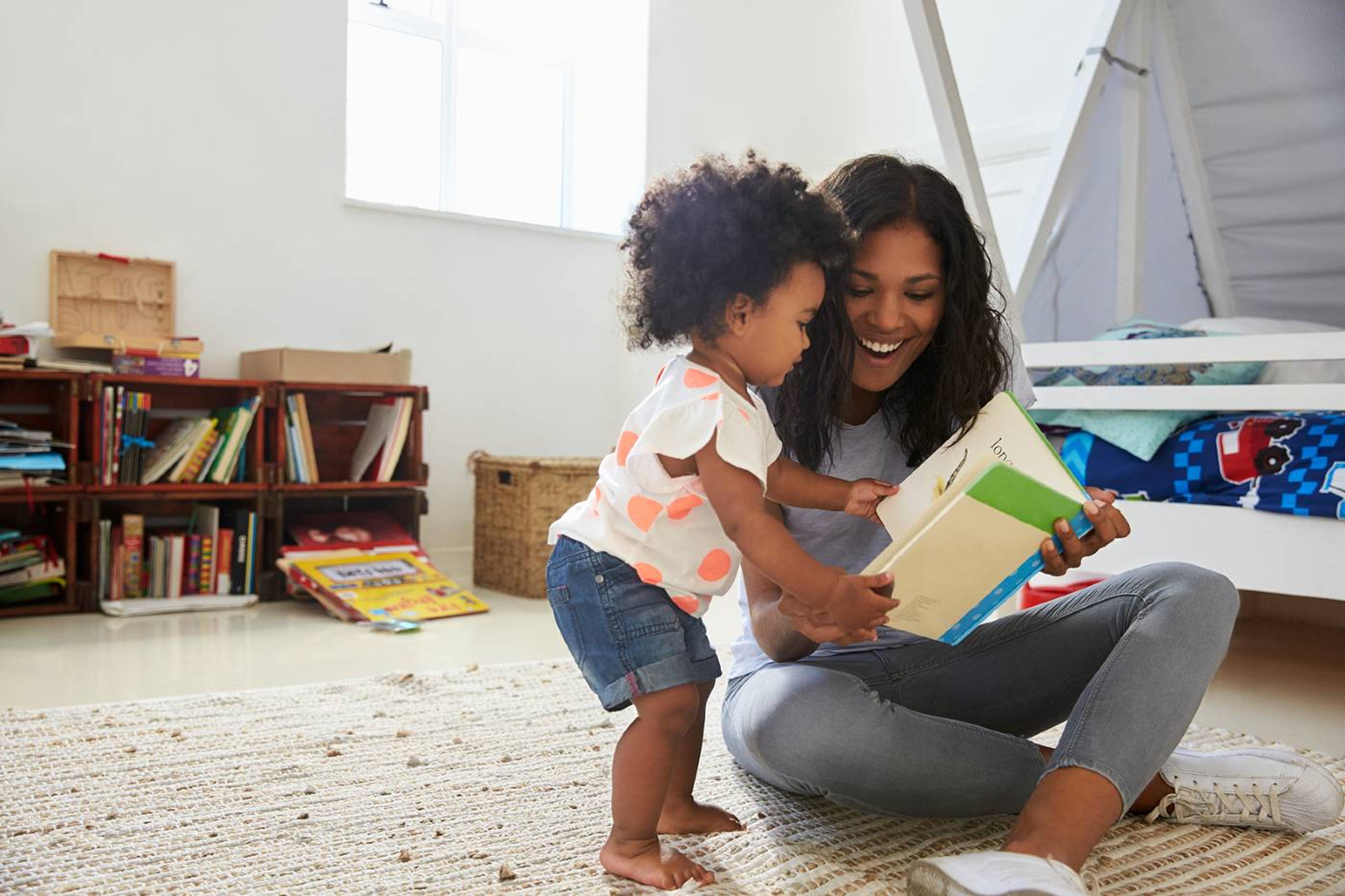 Mom and toddler share a book, boosting language skills
