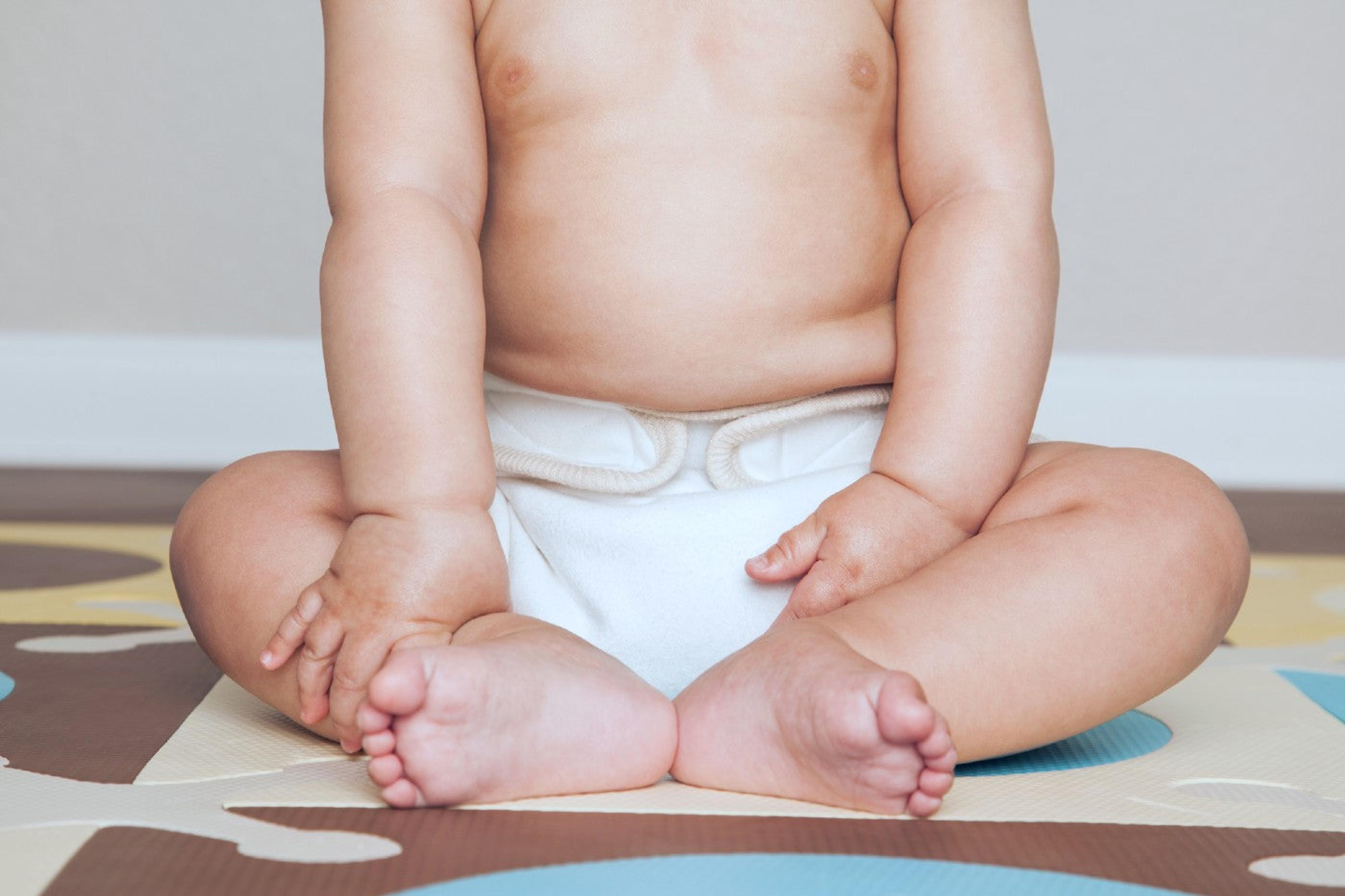 A baby wearing a cloth diaper
