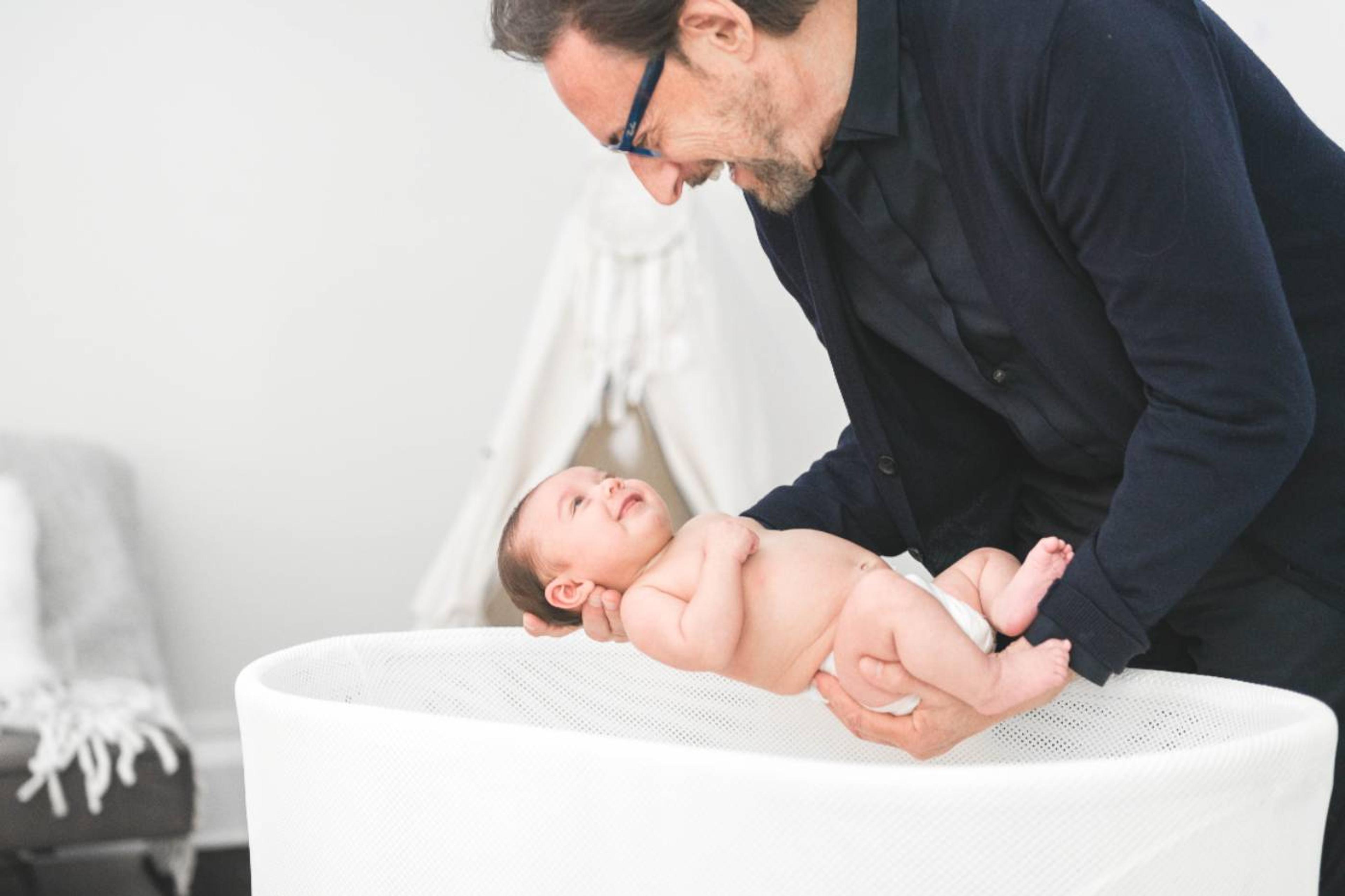 Dr. Harvey Karp placing a baby in SNOO