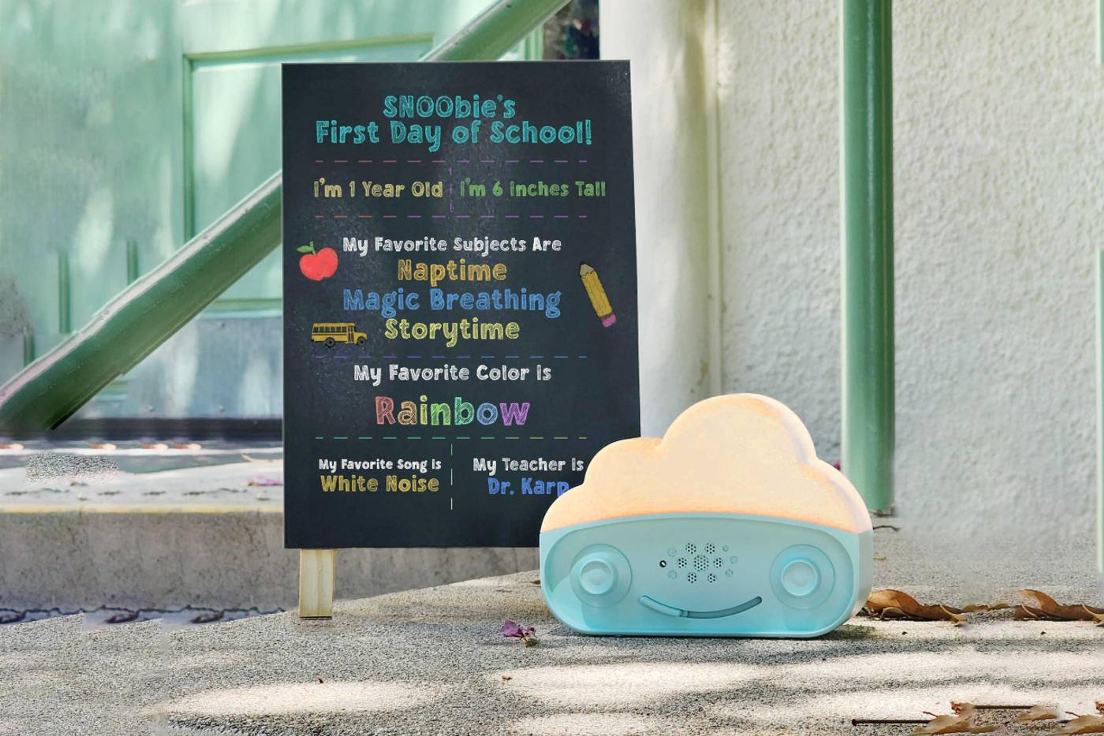 SNOObie with first day of school board