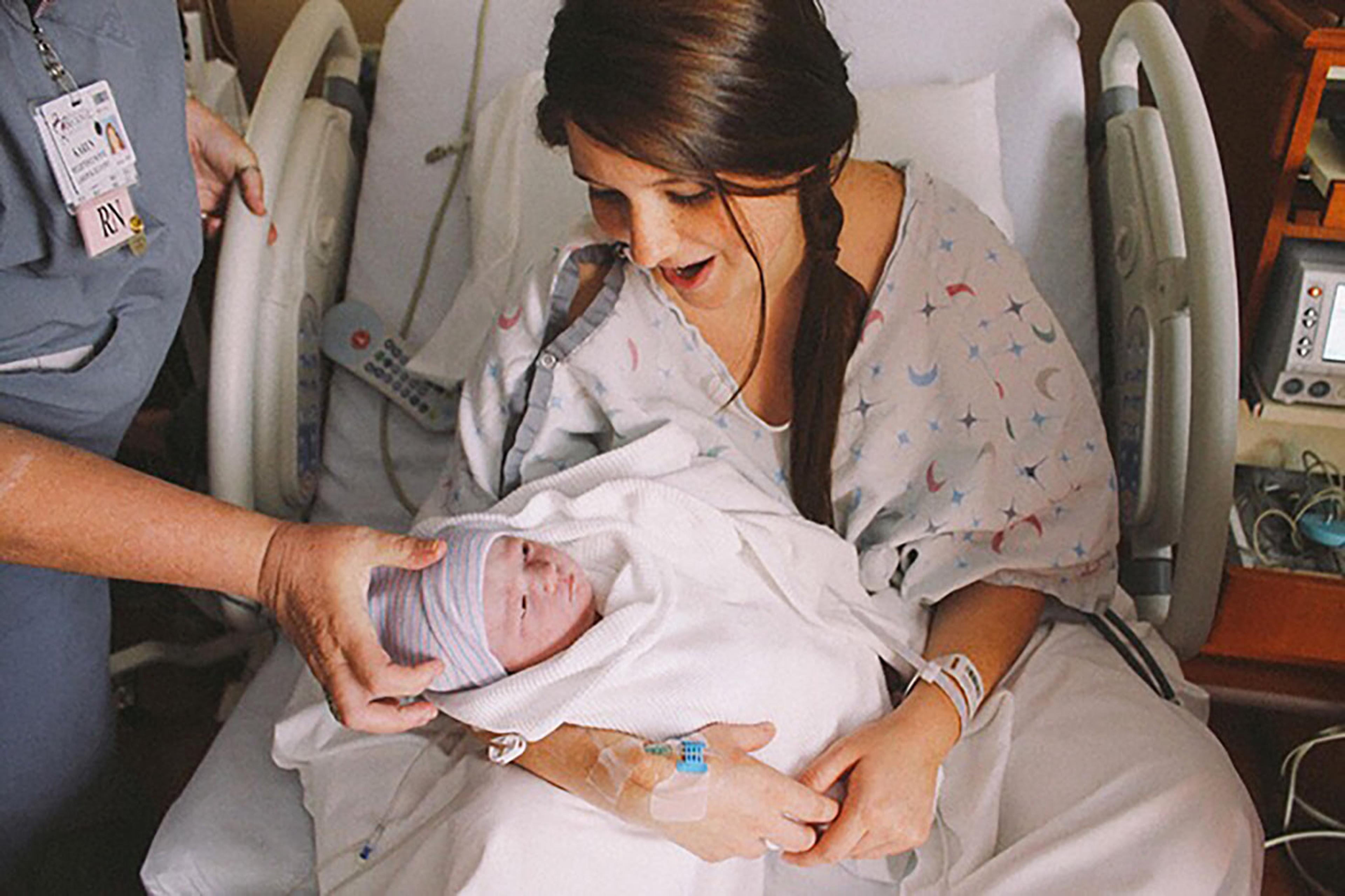 mom-holding-newborn-baby