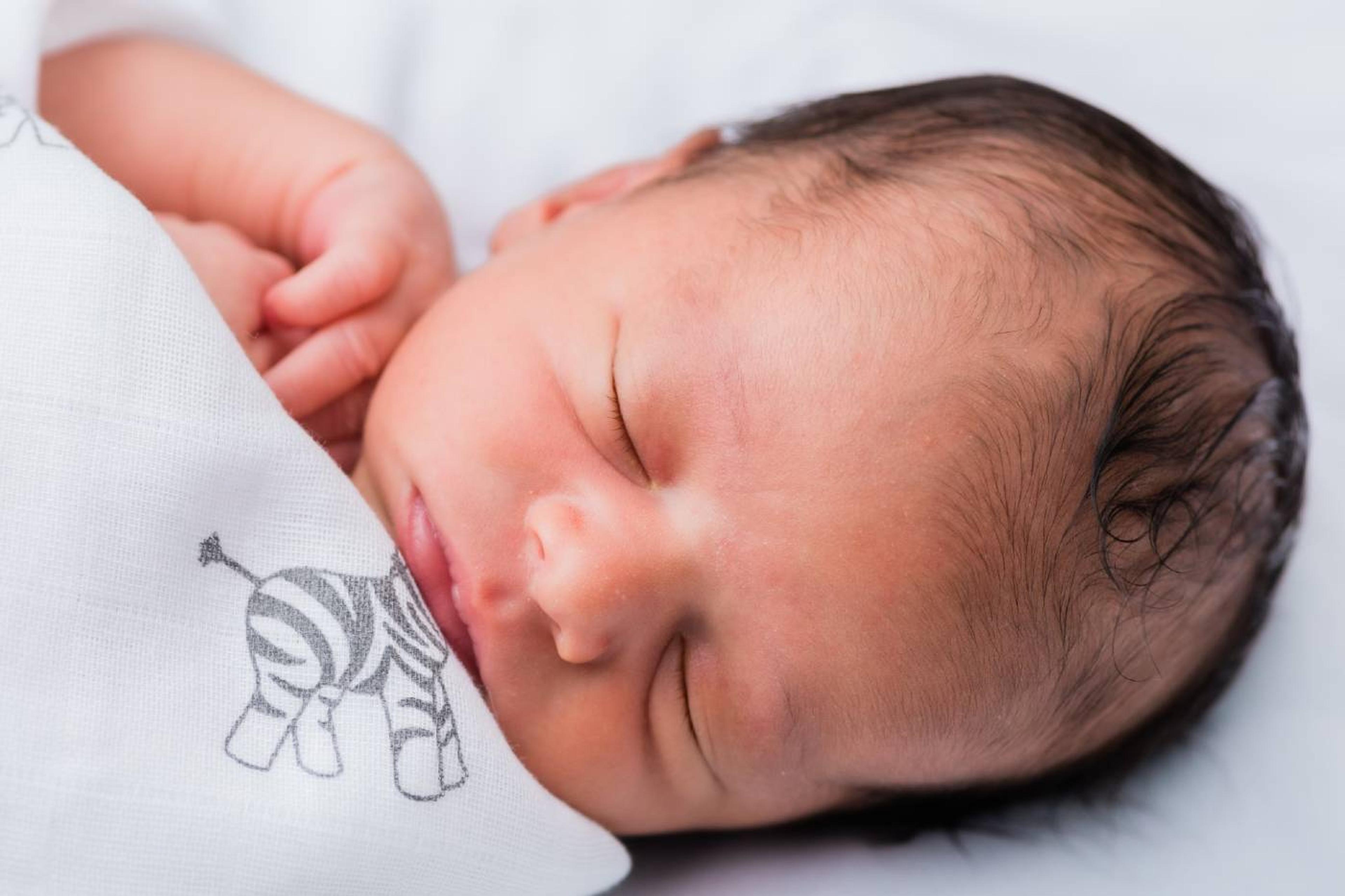 A 1-week-old baby sleeps