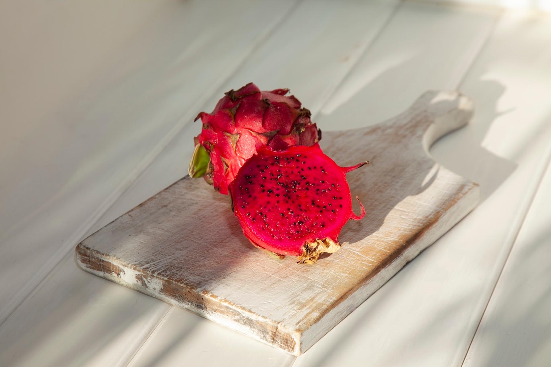 Pitaya (aka dragon fruit) on a cutting board